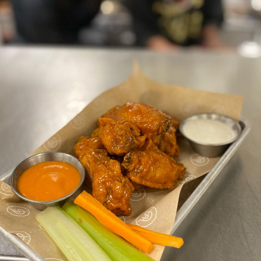 Tallow-fried chicken wings tossed in buffalo sauce