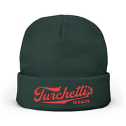 Dark green cuffed knit beanie with red Turchetti's script logo