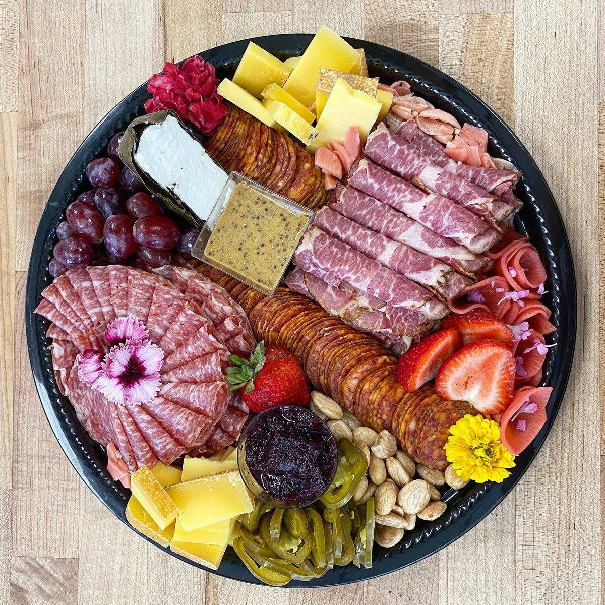 Charcuterie board with salami, cheese and fruit